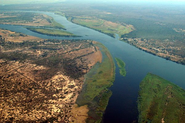 Aerial photo of the confluence of the Kwando (Chobe)
    River (centre left) and the Zambezi River at Kazungula