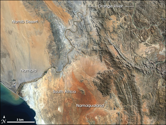 This image shows only the last c. 100 kilometers of the Orange River. In this last stretch the gravel deposits in the river bed and along the banks are rich with diamonds, and several diamond mines operate along the stretch pictured here